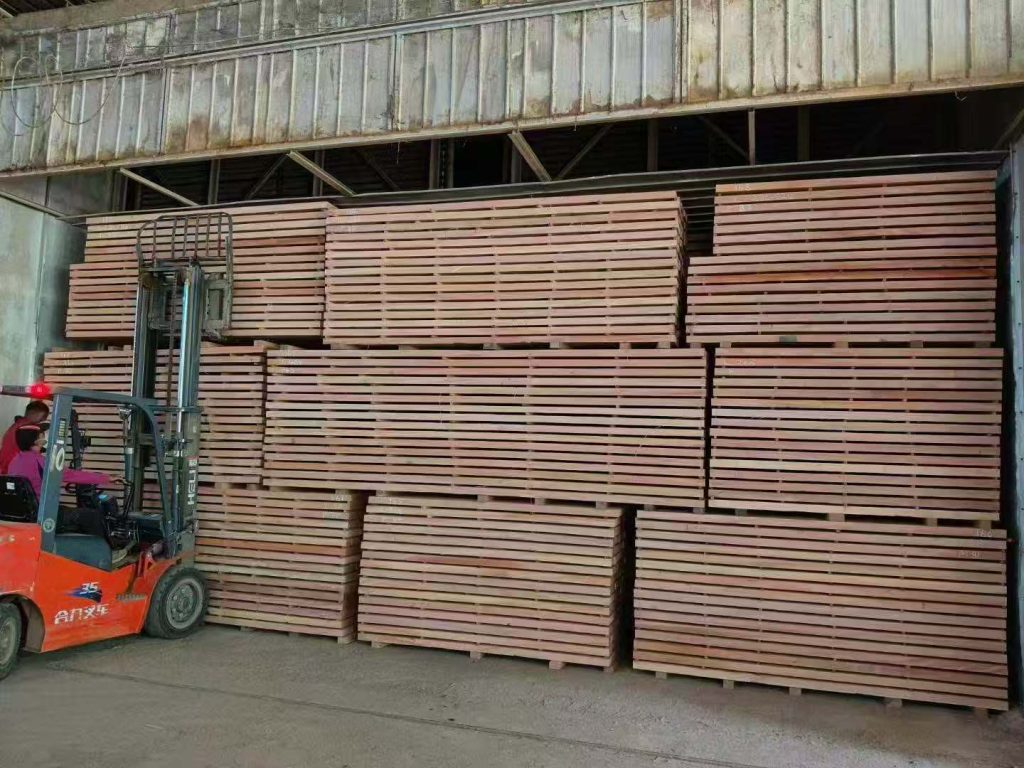 okoume timber exiting kiln drying chamber